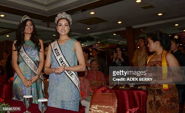 Miss Universe 2012 Olivia Culpo of the US and Indonesian Putri Indonesia 2011 Maria Selena attend a promotional event in Jakarta on January 30, 2013....