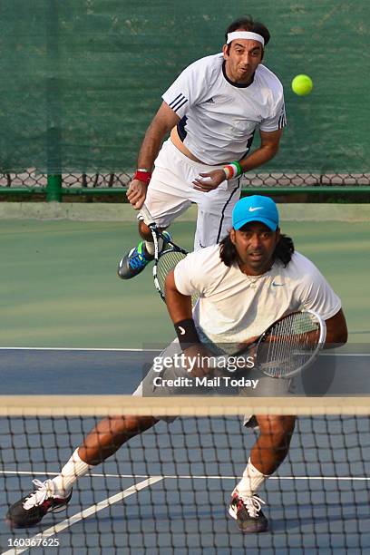 Leander Paes and Purav Raja during a practice session at RK Khanna Tennis Complex in New Delhi on Tuesday.