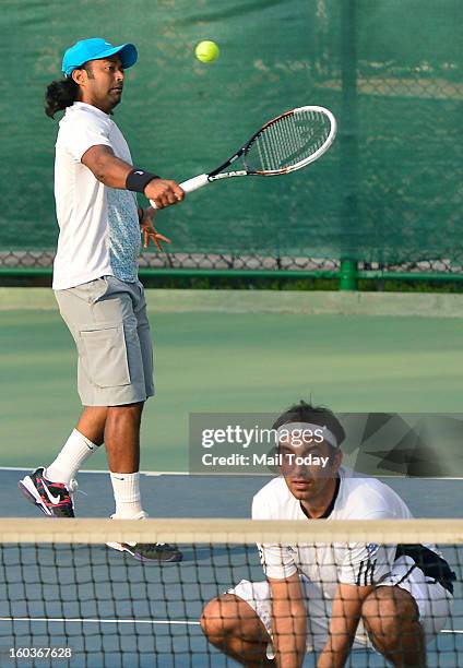 Leander Paes and Purav Raja during a practice session at RK Khanna Tennis Complex in New Delhi on Tuesday.