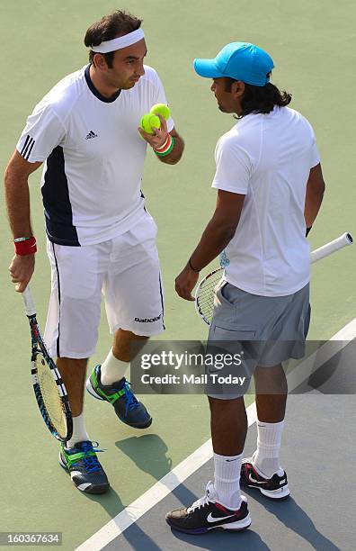 Leander Paes and Purav Raja during a practice session at RK Khanna Tennis Complex in New Delhi on Tuesday.