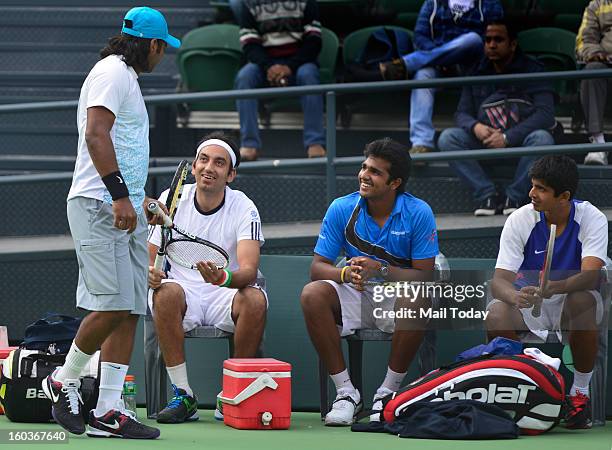 Leander Paes and Purav Raja during a practice session at RK Khanna Tennis Complex in New Delhi on Tuesday.