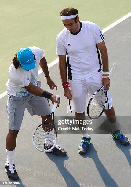 Leander Paes and Purav Raja during a practice session at RK Khanna Tennis Complex in New Delhi on Tuesday.