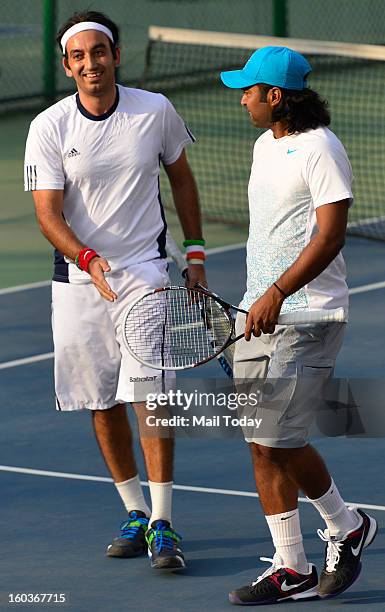 Leander Paes and Purav Raja during a practice session at RK Khanna Tennis Complex in New Delhi on Tuesday.