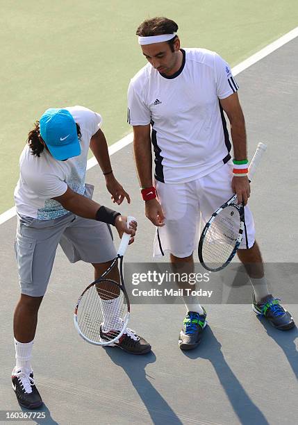 Leander Paes and Purav Raja during a practice session at RK Khanna Tennis Complex in New Delhi on Tuesday.