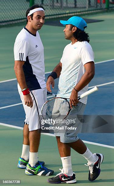 Leander Paes and Purav Raja during a practice session at RK Khanna Tennis Complex in New Delhi on Tuesday.