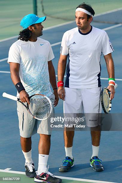 Leander Paes and Purav Raja during a practice session at RK Khanna Tennis Complex in New Delhi on Tuesday.