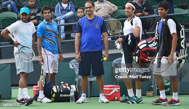 Leander Paes and Purav Raja and others during a practice session at RK Khanna Tennis Complex in New Delhi on Tuesday.