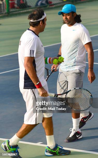 Leander Paes and Purav Raja during a practice session at RK Khanna Tennis Complex in New Delhi on Tuesday.