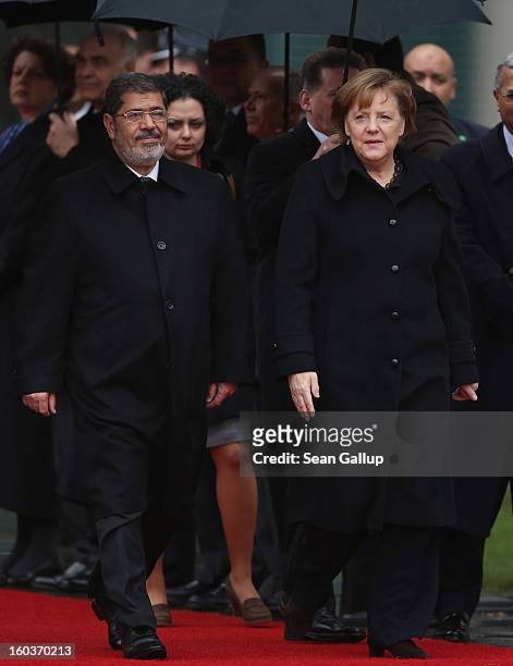 German Chancellor Angela Merkel welcomes Egyptian President Mohamed Mursi upon his arrival at the Chancellery on January 30, 2013 in Berlin, Germany....