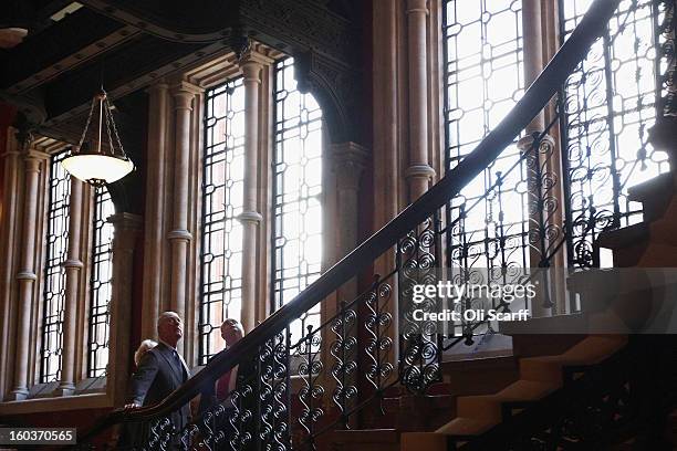 Prince Charles, Prince of Wales and Camilla, Duchess of Cornwall view the grand staircase with Hotel Historian Royden Stock during a visit to the...
