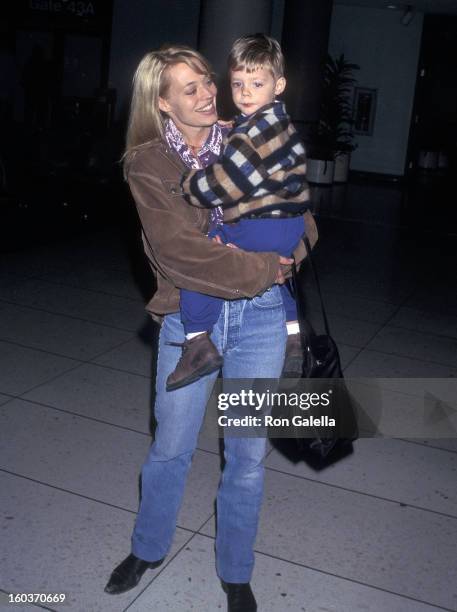 Actress Jeri Ryan and son Alex depart for New York City on March 10, 1997 at the Los Angeles International Airport in Los Angeles, California.
