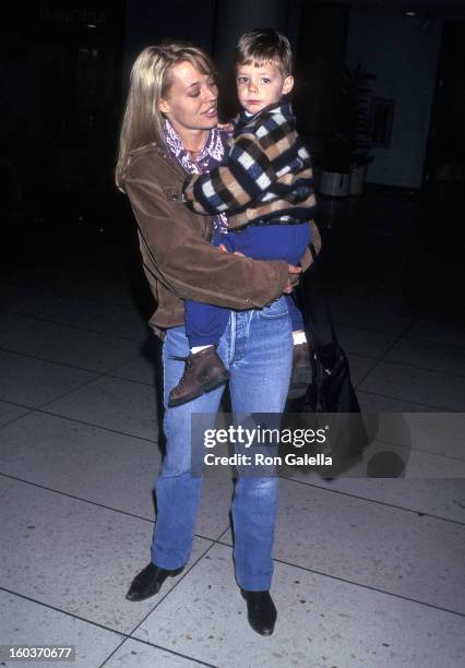 Actress Jeri Ryan and son Alex depart for New York City on March 10, 1997 at the Los Angeles International Airport in Los Angeles, California.