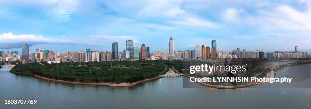 haikou evergreen park in daytime drone angle of view - lynnhsin stock-fotos und bilder