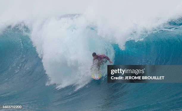 Australia's surfer Jack Robinson rides a wave during the men's final of the Tahiti World Surf League professional competition, also a surfing test...