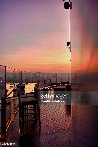 outdoor lounge at sunset - bangkok hotel stock pictures, royalty-free photos & images