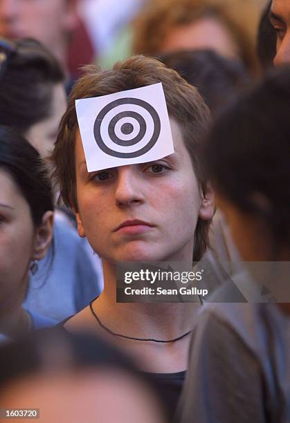 Demonstrator wears a target on her forehead July 23, 2001 in Rome, Italy to protest the July 20 shooting of Carlo Giuliani, an Italian anti-G8...