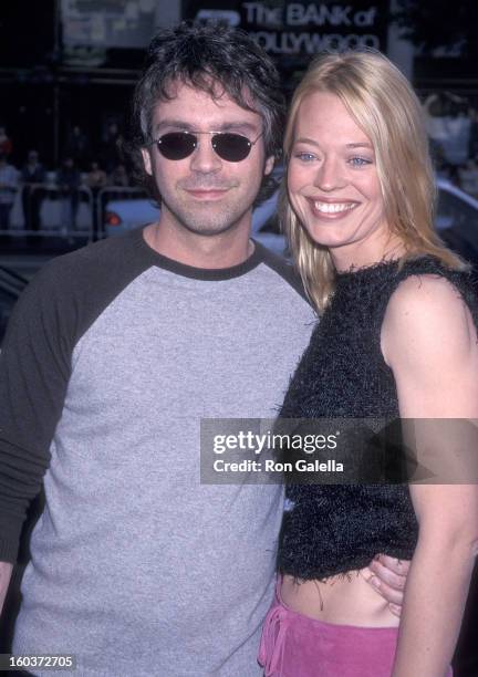 Producer Brannon Braga and actress Jeri Ryan attend the "Galaxy Quest" Hollywood Premiere on December 19, 1999 at the Mann's Chinese Theatre in...