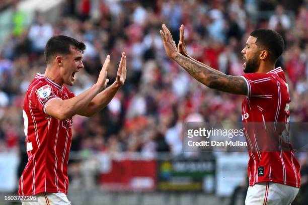 Jason Knight of Bristol City celebrates with teammate Nahki Wells after scoring the team's second goal during the Carabao Cup First Round match...
