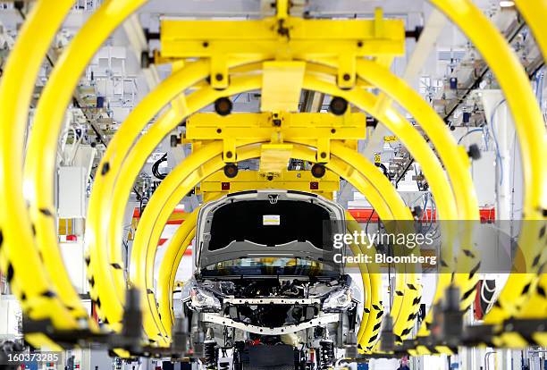 Maserati Quattroporte luxury automobile moves along the production line following the inauguration of Fiat SpA's Grugliasco factory in Turin, Italy,...