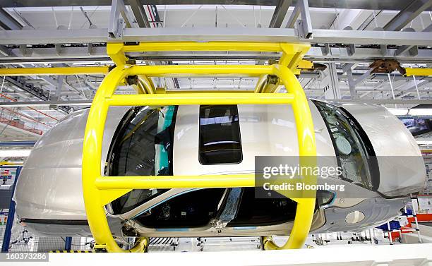 Maserati Quattroporte luxury automobile moves along the production line following the inauguration of Fiat SpA's Grugliasco factory in Turin, Italy,...