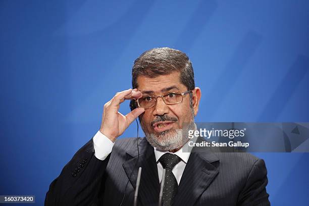 Egyptian President Mohamed Mursi speaks to the media with German Chancellor Angela Merkel following talks at the Chancellery on January 30, 2013 in...