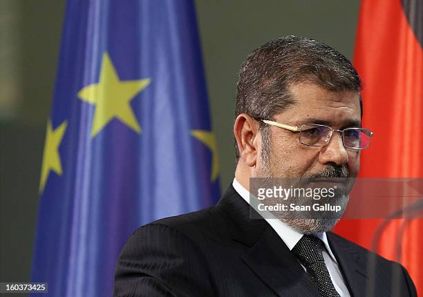 Egyptian President Mohamed Mursi arrives to speak to the media with German Chancellor Angela Merkel following talks at the Chancellery on January 30,...
