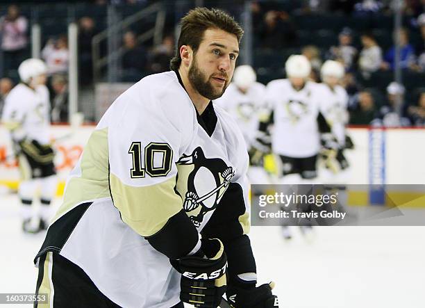 Tanner Glass of the Pittsburgh Penguins takes part in the pre-game warm up prior to NHL action against the Winnipeg Jets at the MTS Centre on January...