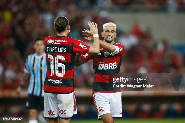 Giorgian de Arrascaeta and Filipe Luis of Flamengo reacts during a semifinal second leg match between Flamengo and Gremio as part of Copa do Brasil...