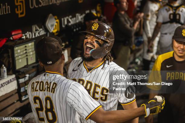 Fernando Tatis Jr. #23 of the San Diego Padres celebrates in the dugout after stealing home plate in the seventh inning against the Baltimore Orioles...