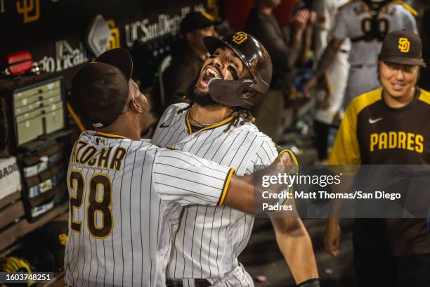 Fernando Tatis Jr. #23 of the San Diego Padres celebrates in the dugout after stealing home plate in the seventh inning against the Baltimore Orioles...