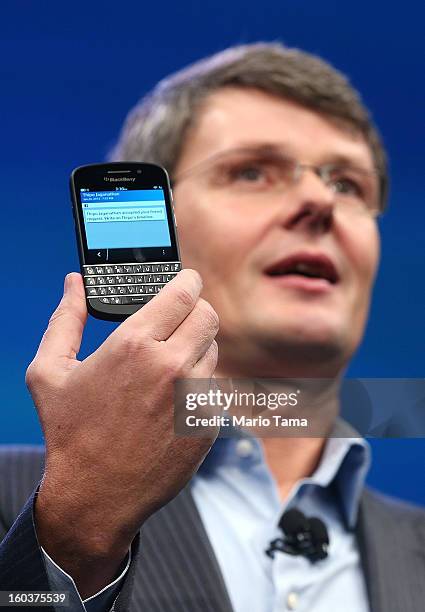 BlackBerry Chief Executive Officer Thorsten Heins displays one of the new Blackberry 10 smartphones with a physical keyboard at the BlackBerry 10...