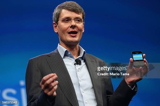 BlackBerry Chief Executive Officer Thorsten Heins displays one of the new Blackberry 10 smartphones at the BlackBerry 10 launch event by Research in...