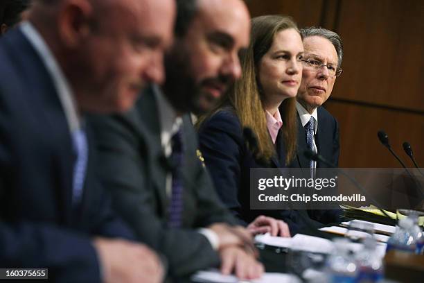 National Rifle Association Executive Vice President and Chief Executive Officer Wayne LaPierre listens to testimony from fellow witnesses retired...