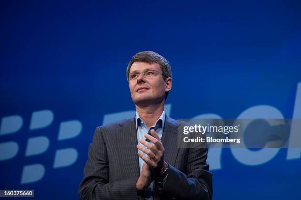 Thorsten Heins, chief executive officer of Research In Motion Ltd. , applauds while speaking at the launch of the BlackBerry 10 in New York, U.S., on...