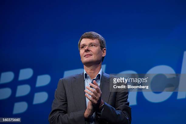 Thorsten Heins, chief executive officer of Research In Motion Ltd. , applauds while speaking at the launch of the BlackBerry 10 in New York, U.S., on...