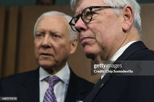 Senate Judiciary Committee member U.S. Sen. Orrin Hatch talks with National Rifle Association President David Keene before a hearing about gun...