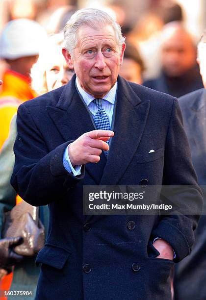 Prince Charles, Prince of Wales walks to Farringdon Underground Station, after viewing the nearby Crossrail development site, to travel on a...