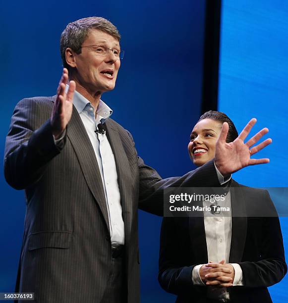 BlackBerry President and Chief Executive Officer Thorsten Heins stands with new BlackBerry Global Creative Director Alicia Keys at the BlackBerry 10...