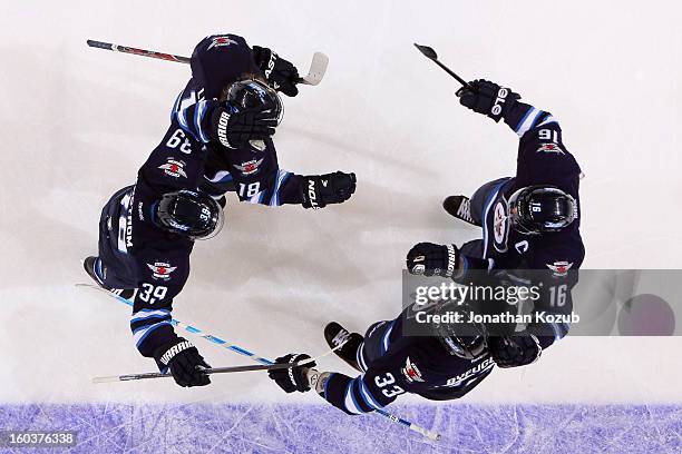 Tobias Enstrom, Bryan Little, Dustin Byfuglien and Andrew Ladd of the Winnipeg Jets celebrate a second period goal against the Pittsburgh Penguins at...