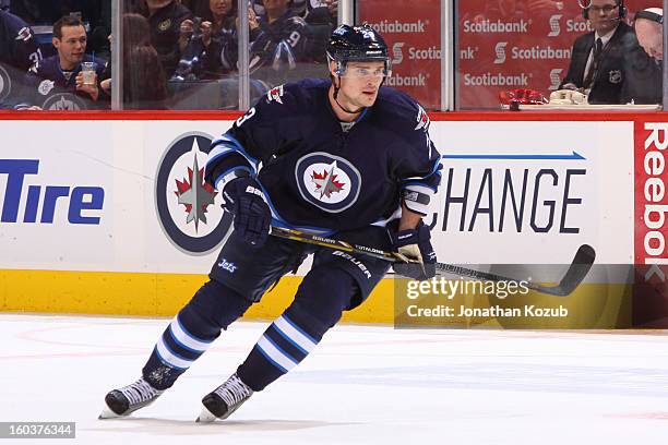 Alexei Ponikarovsky of the Winnipeg Jets keeps an eye on the play during third period action against the Pittsburgh Penguins at the MTS Centre on...