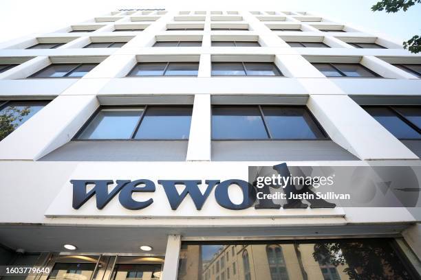Sign is posted on the exterior of a WeWork office on August 09, 2023 in Berkeley, California. New York-based workspace-sharing company WeWork says it...