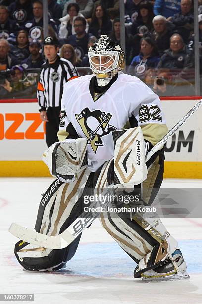 Goaltender Tomas Vokoun of the Pittsburgh Penguins keeps an eye on the play during third period action against the Winnipeg Jets at the MTS Centre on...