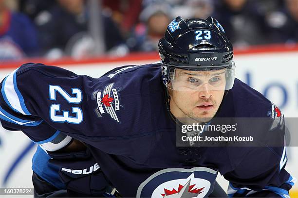 Alexei Ponikarovsky of the Winnipeg Jets gets set for a first period face-off against the Pittsburgh Penguins at the MTS Centre on January 25, 2013...