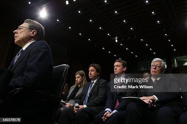 National Rifle Association President David Keene , watches as Wayne LaPierre answers questions at the witness table during a Senate Judiciary...