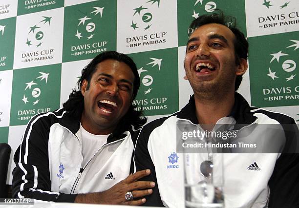 Leander Paes of Indian Davis Cup team with his doubles partner Purav Raja during pre-draw press conference at DLTA on January 30, 2013 in New Delhi,...