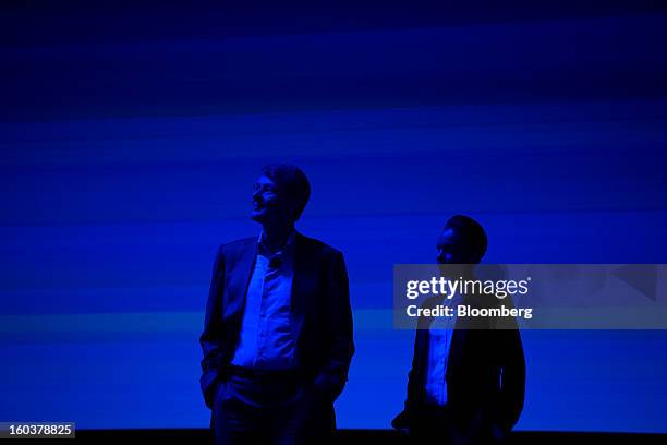 Thorsten Heins, chief executive officer of BlackBerry, and Alicia Keys, Global Creative Director for BlackBerry, listen during the launch of the...