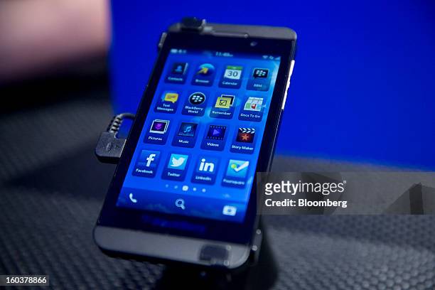 The new BlackBerry 10 is displayed during the device's launch in New York, U.S., on Wednesday, Jan. 30, 2013. Research In Motion Ltd. , taking the...