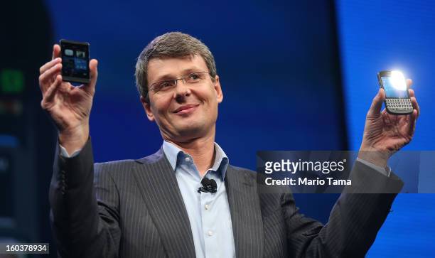 BlackBerry Chief Executive Officer Thorsten Heins displays the new Blackberry 10 smartphones at the BlackBerry 10 launch event at Pier 36 in...