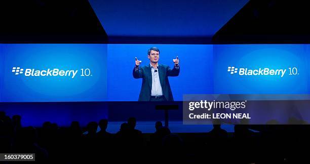 Guests watch a live video stream of the presentation by BlackBerry president and CEO, Thorsten Heins, at one of eight simultaneous worldwide events...