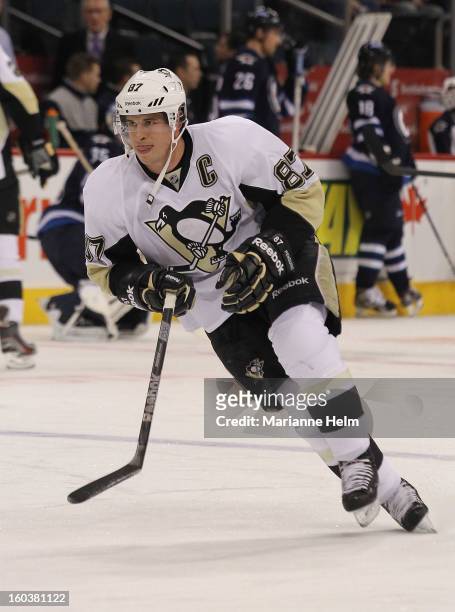 Sidney Crosby of the Pittsburgh Penguins skates during warmup before a game against the Winnipeg Jets on January 25, 2013 at the MTS Centre in...